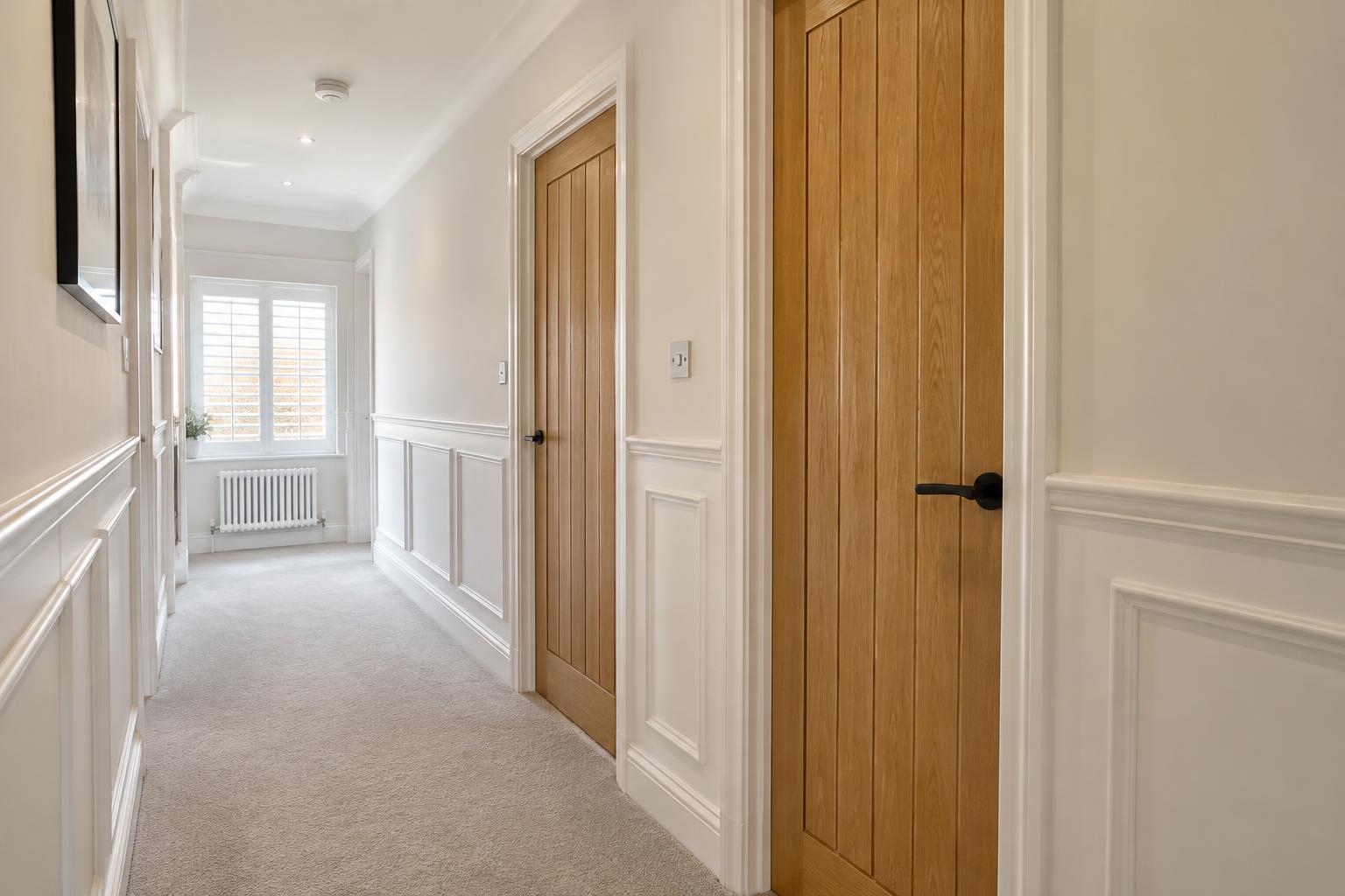 Fitted oak internal doors with wall panelling